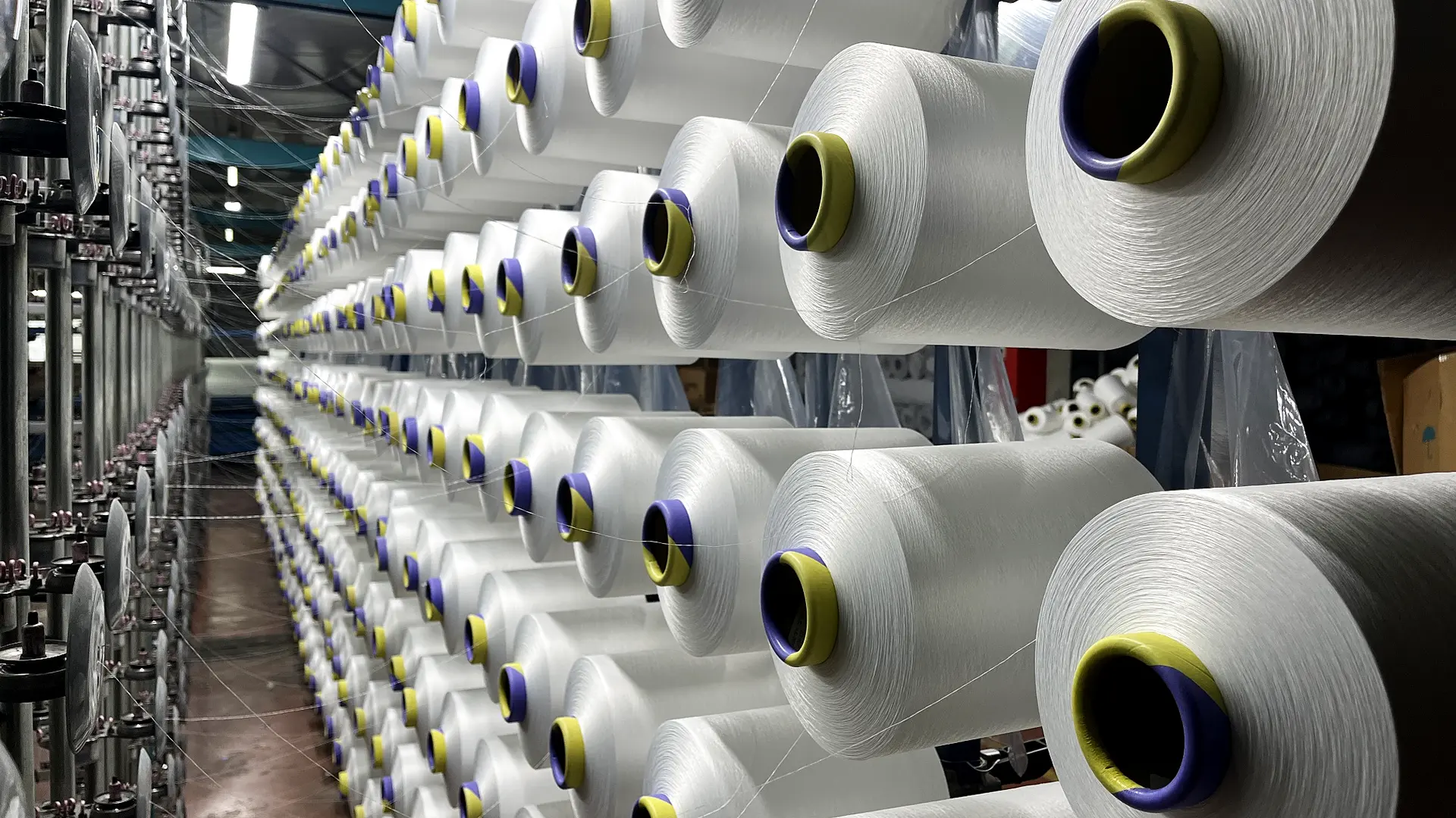 Yarn cones lined up on the warping creel