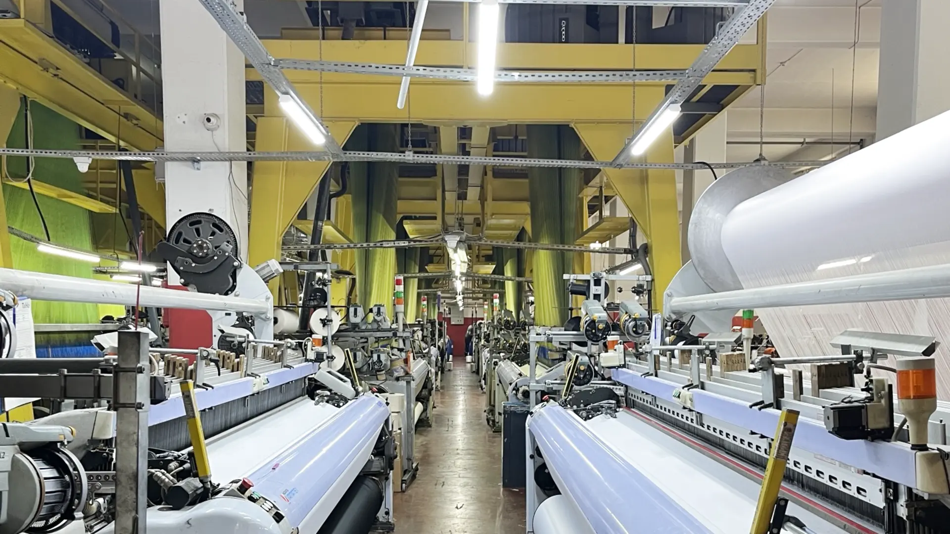 Rows of looms in our weaving hall